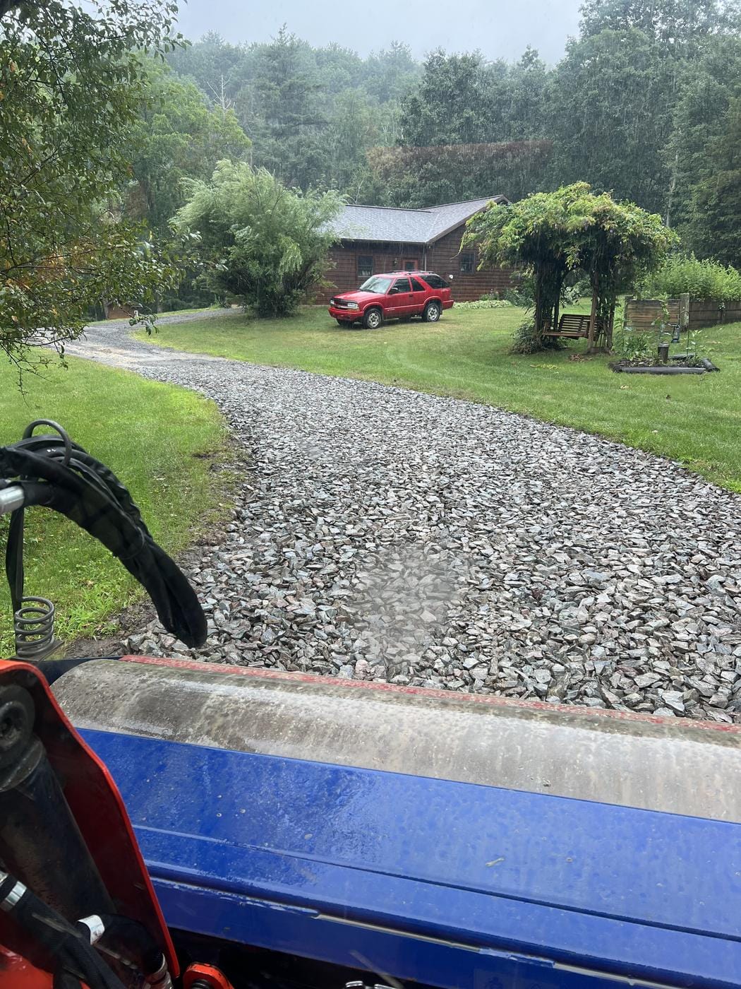 The same drive with new stone laid down, seen from the tractor.